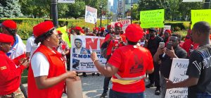Doreen Kajuumba and Nakato Brenda together with protesters at Ontario provential periament preparing to submit petition for MUSEVENMUSTGO -photo by CMPpublications 